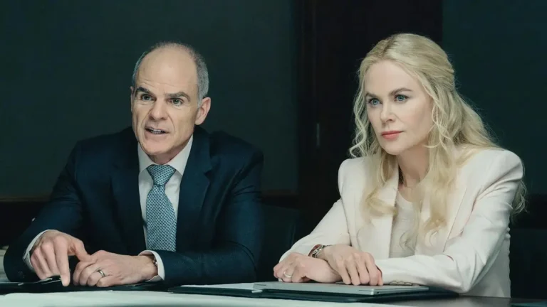 Michael Kelly and Nicole Kidman sitting side-by-side at a conference table in Special Ops: Lioness.