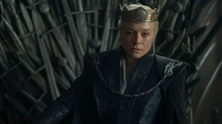 Emma D'Arcy as Queen Rhaenyra Targaryen wearing a crown while seated on the Iron Throne in House of the Dragon.
