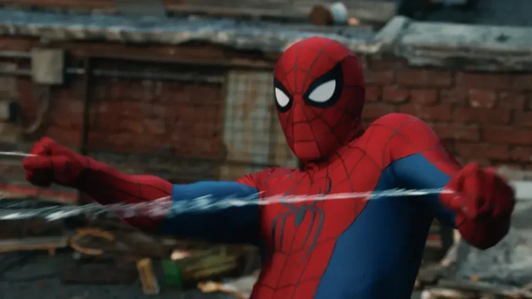 Spider-Man in his classic red and blue suit shooting web-lines horizontally across a rooftop.