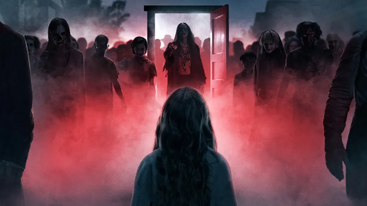 Rear view of a girl standing in red fog facing a crowd of eerie figures and ghosts emerging from an open red door in Insidious.