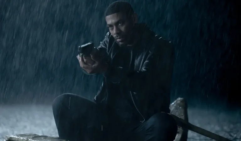 Aaron Pierre as John Stewart in a rainy scene from the DC series Lanterns