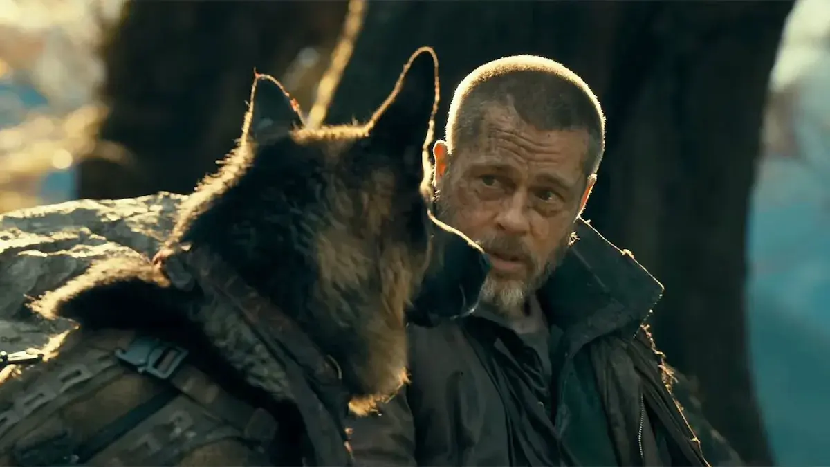 Brad Pitt alongside a German Shepherd in the survival drama film Heart of the Beast