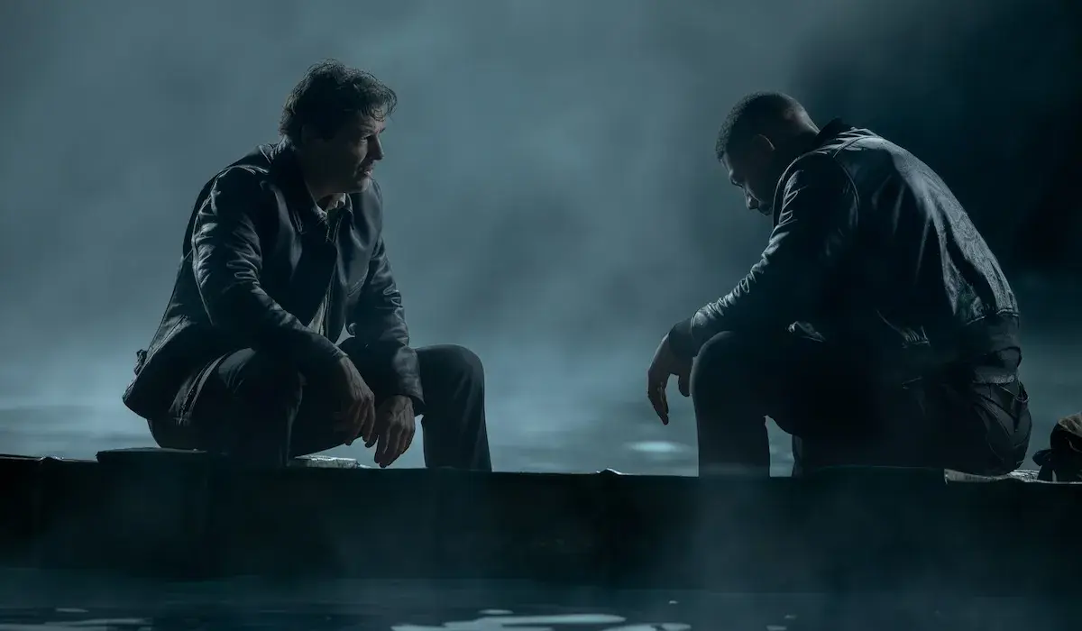 Hal Jordan (Kyle Chandler) and John Stewart sitting together on a boat in a dramatic scene from the HBO series Lanterns