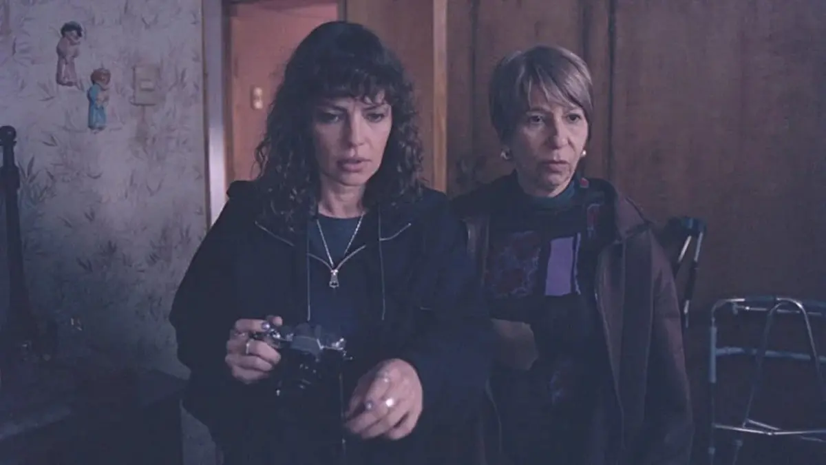 Mariana Enriquez (holding a vintage camera on the left) alongside actress Mercedes Morán (right) in connection with the supernatural horror miniseries My Sad Dead (Mis muertos tristes)